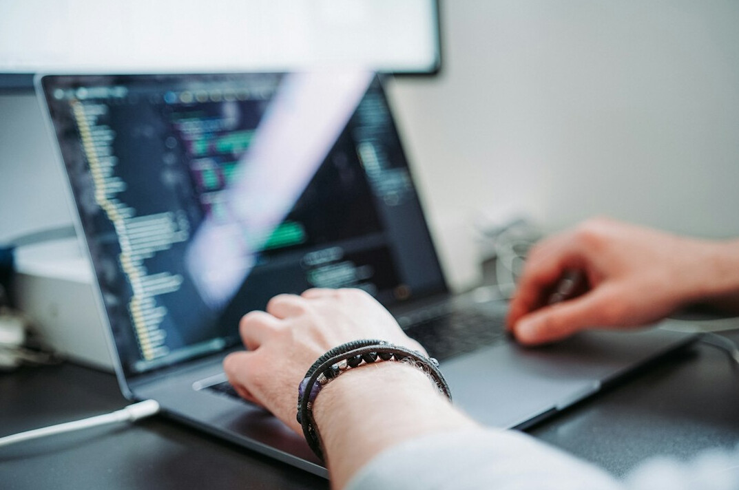 programmer at desk coding