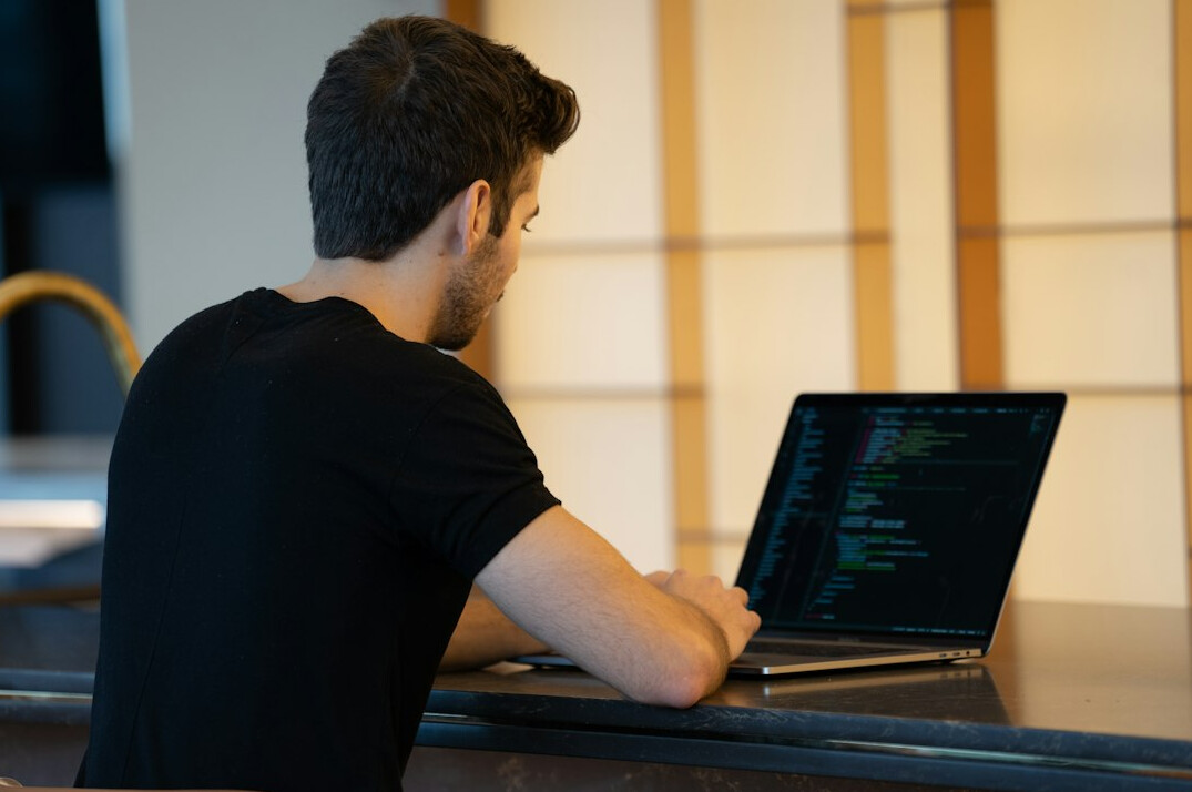 programmer at desk coding
