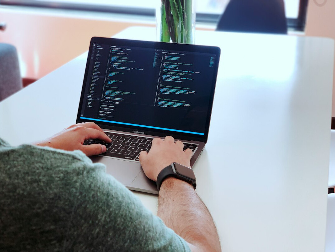 programmer coding at desk